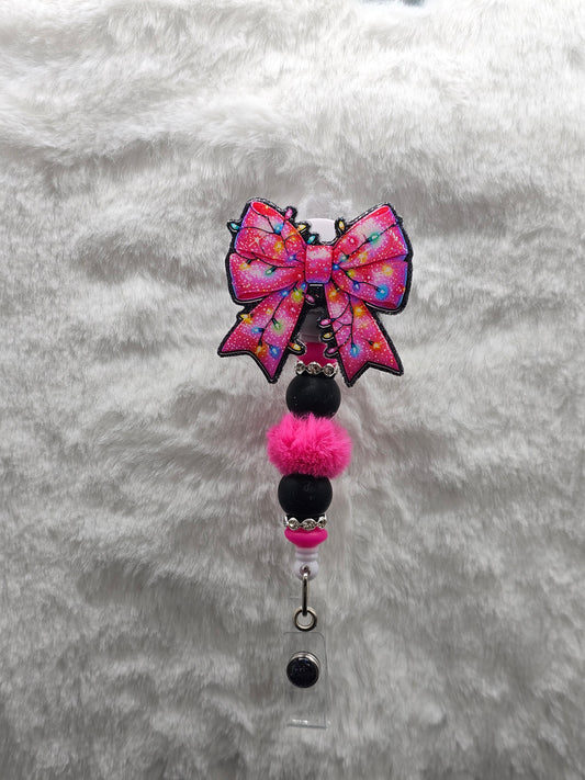 Pink Christmas Light Bow Badge Reel