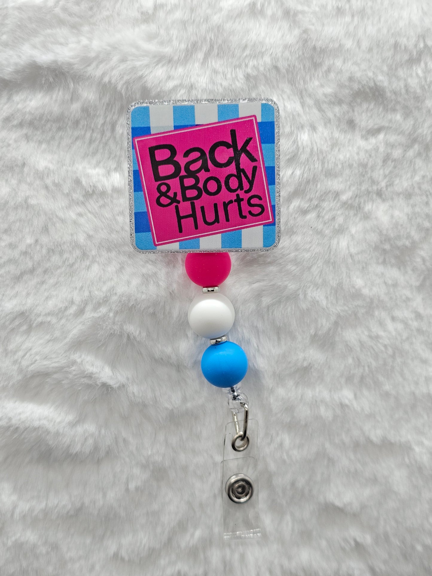 Back and Body Hurts Badge Reel